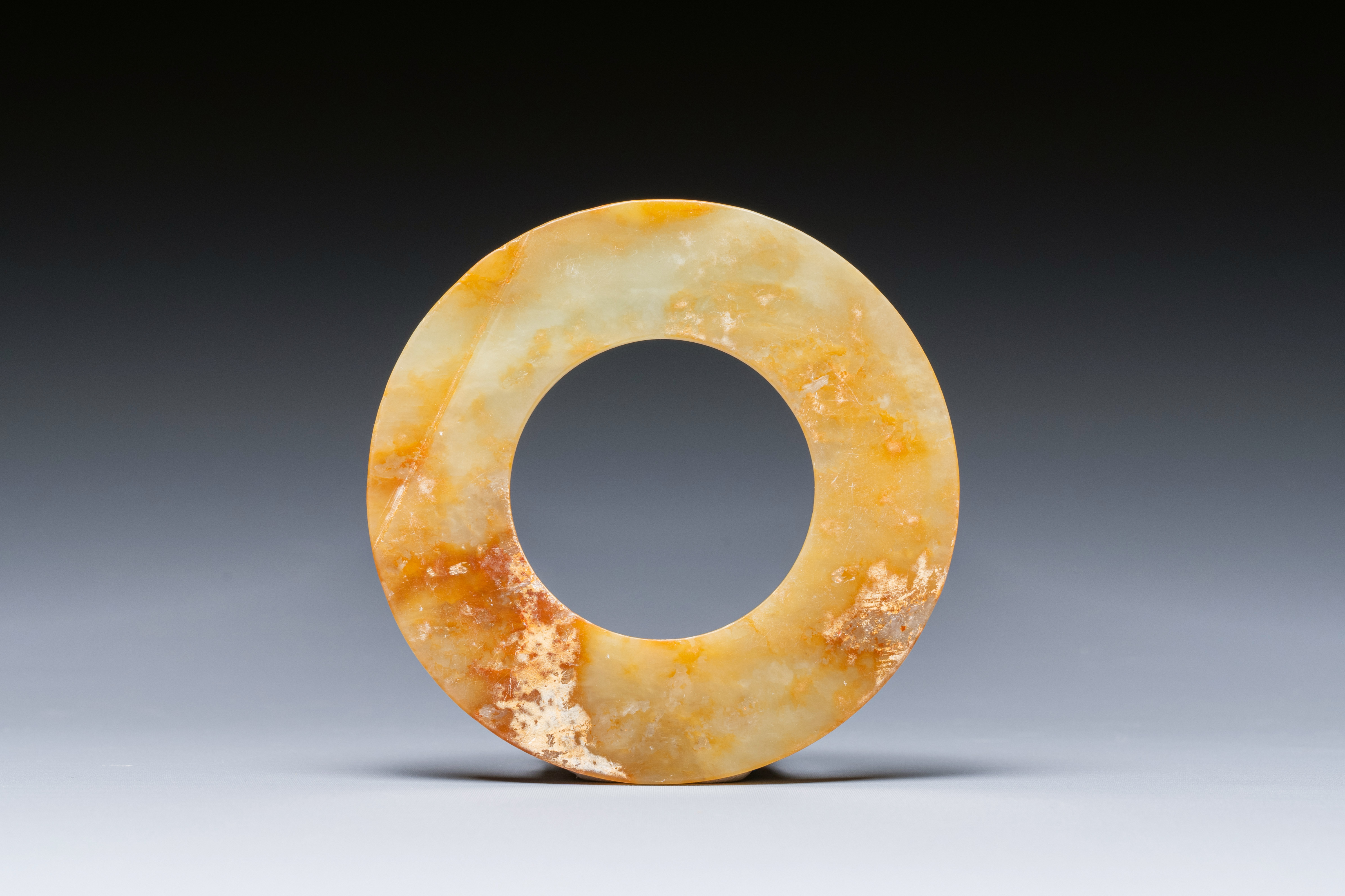 A Chinese celadon and russet jade 'bi' disc, probably Han - Image 3 of 4