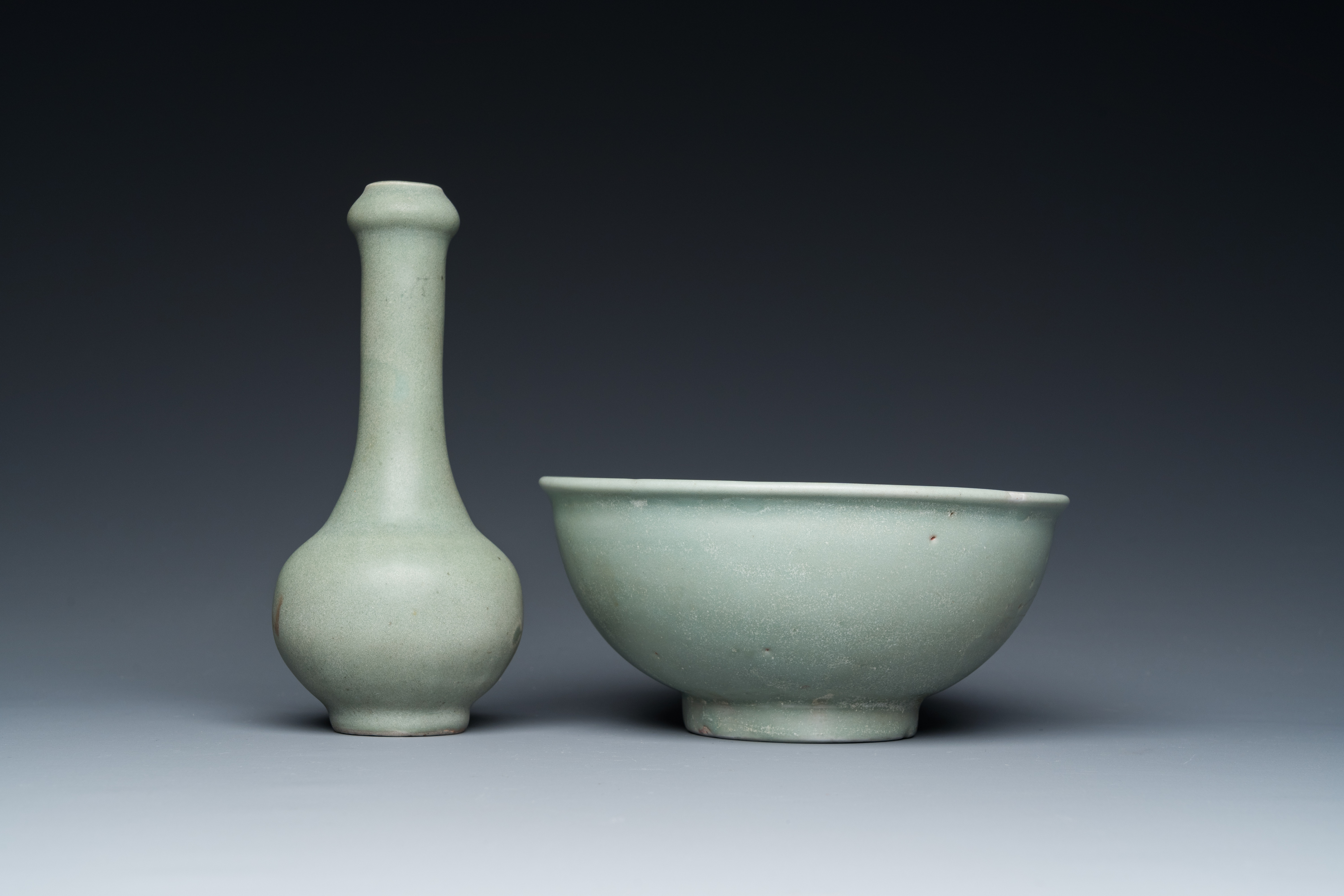A Chinese celadon-glazed bottle vase and two bowls, Yuan/Ming - Image 7 of 9