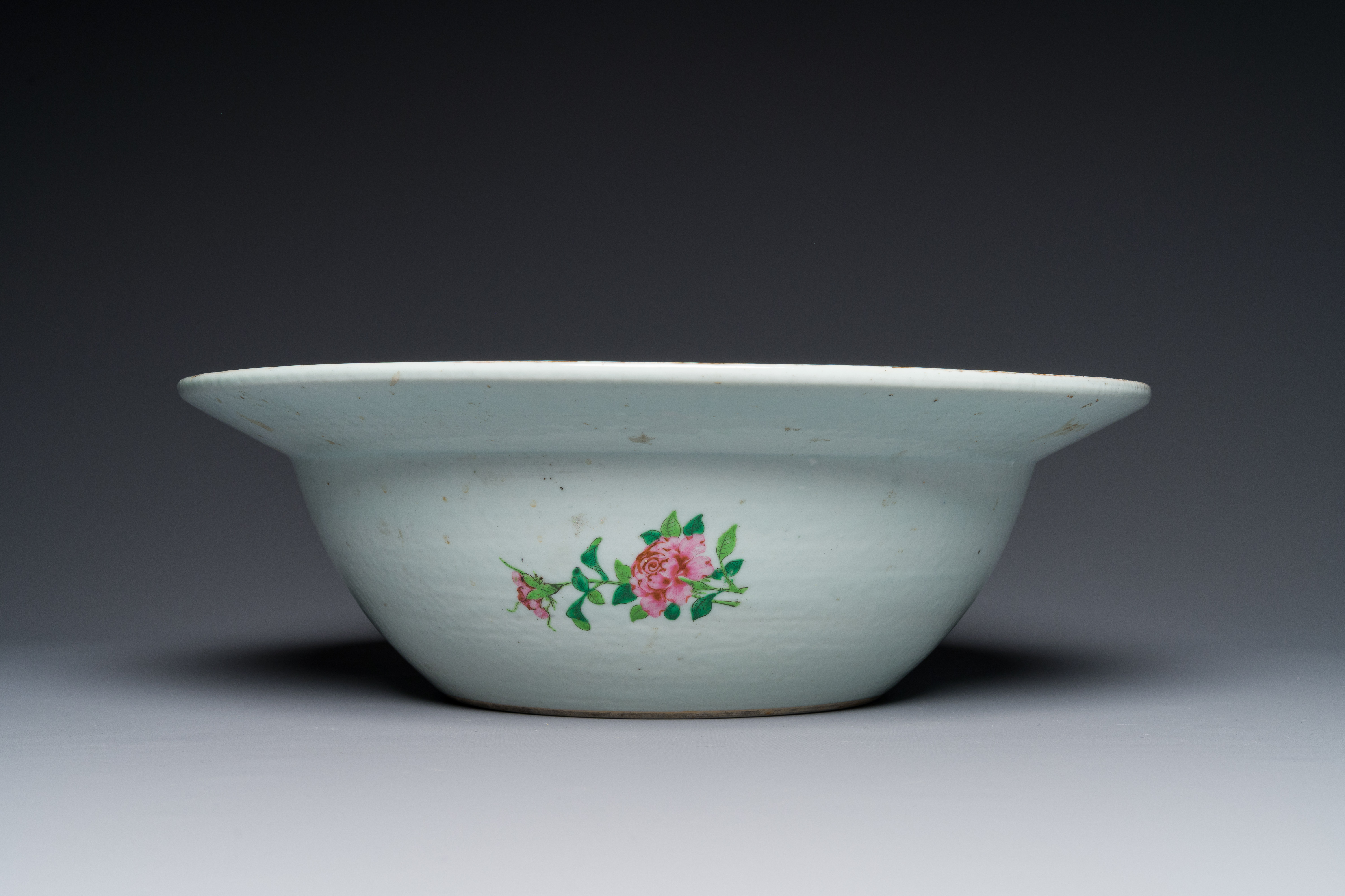 A large Chinese Canton famille rose 'Qi Lin Song Zi' basin, 19th C. - Image 4 of 5
