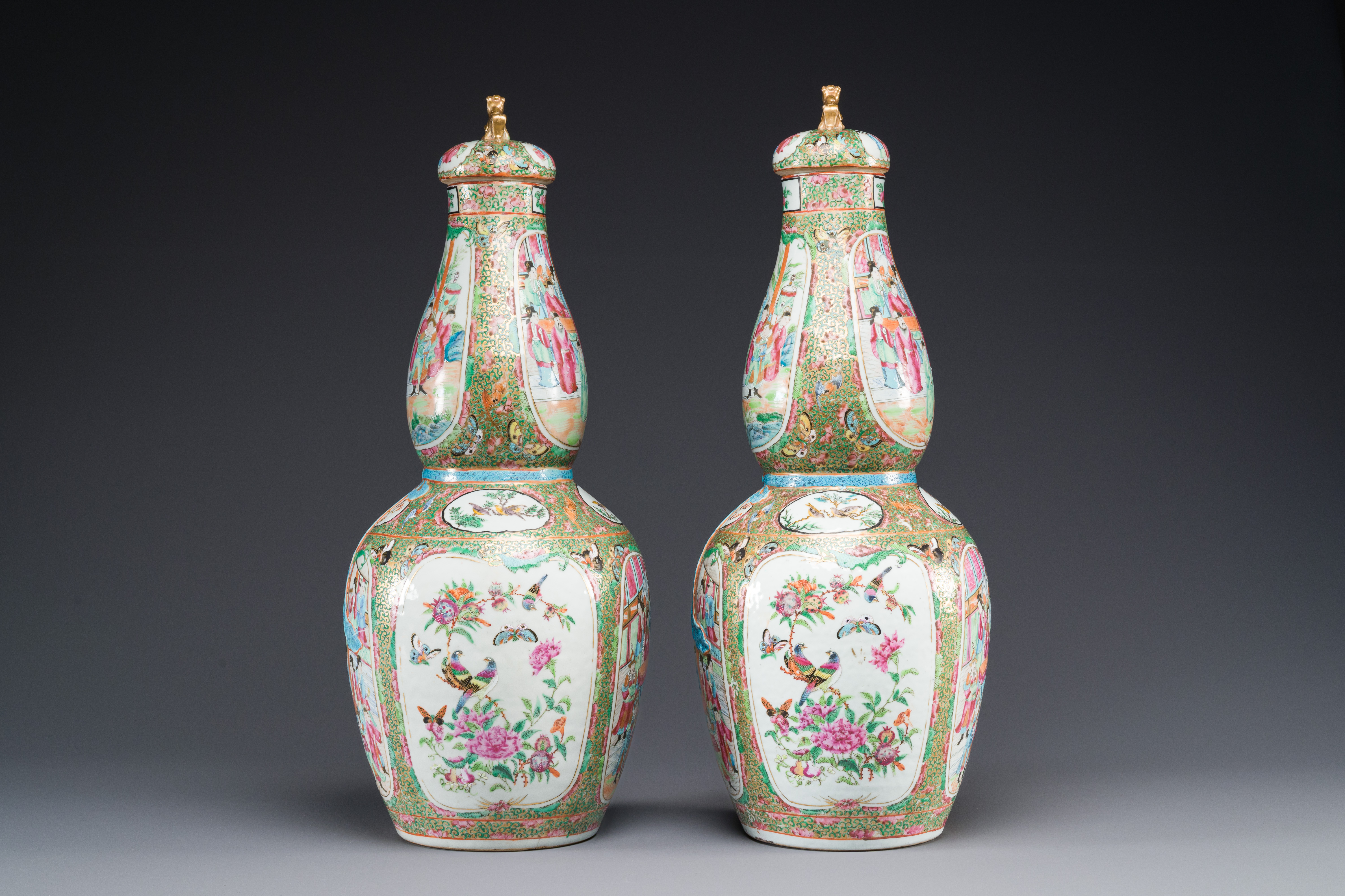 A pair of Chinese Canton famille rose double gourd vases and covers, 19th C. - Image 2 of 6