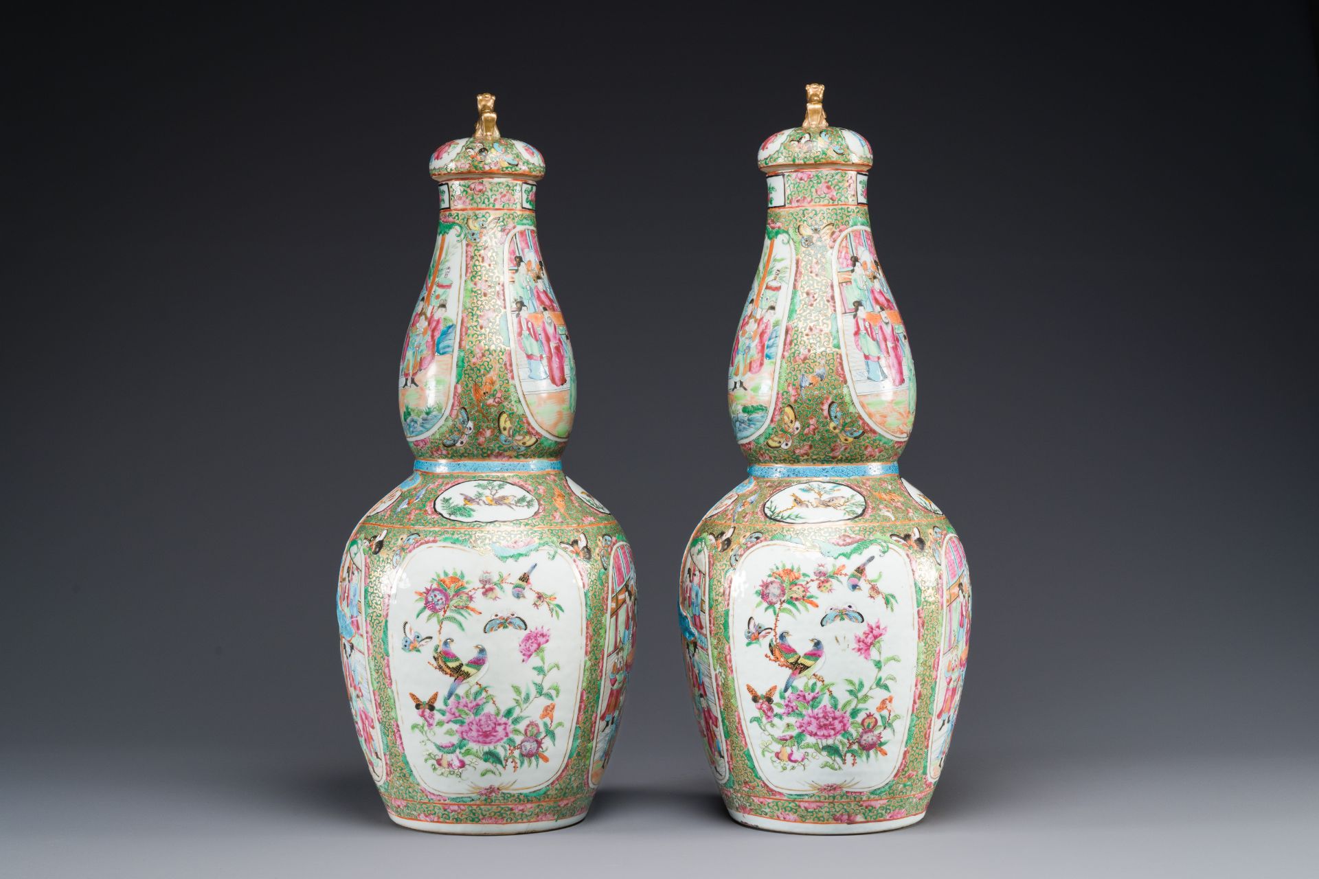 A pair of Chinese Canton famille rose double gourd vases and covers, 19th C. - Image 2 of 6