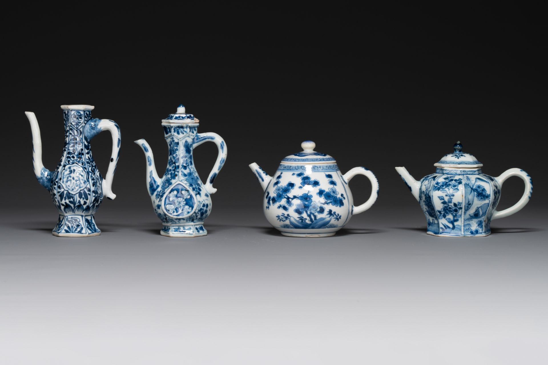 Two Chinese blue and white ewers and two teapots, Kangxi