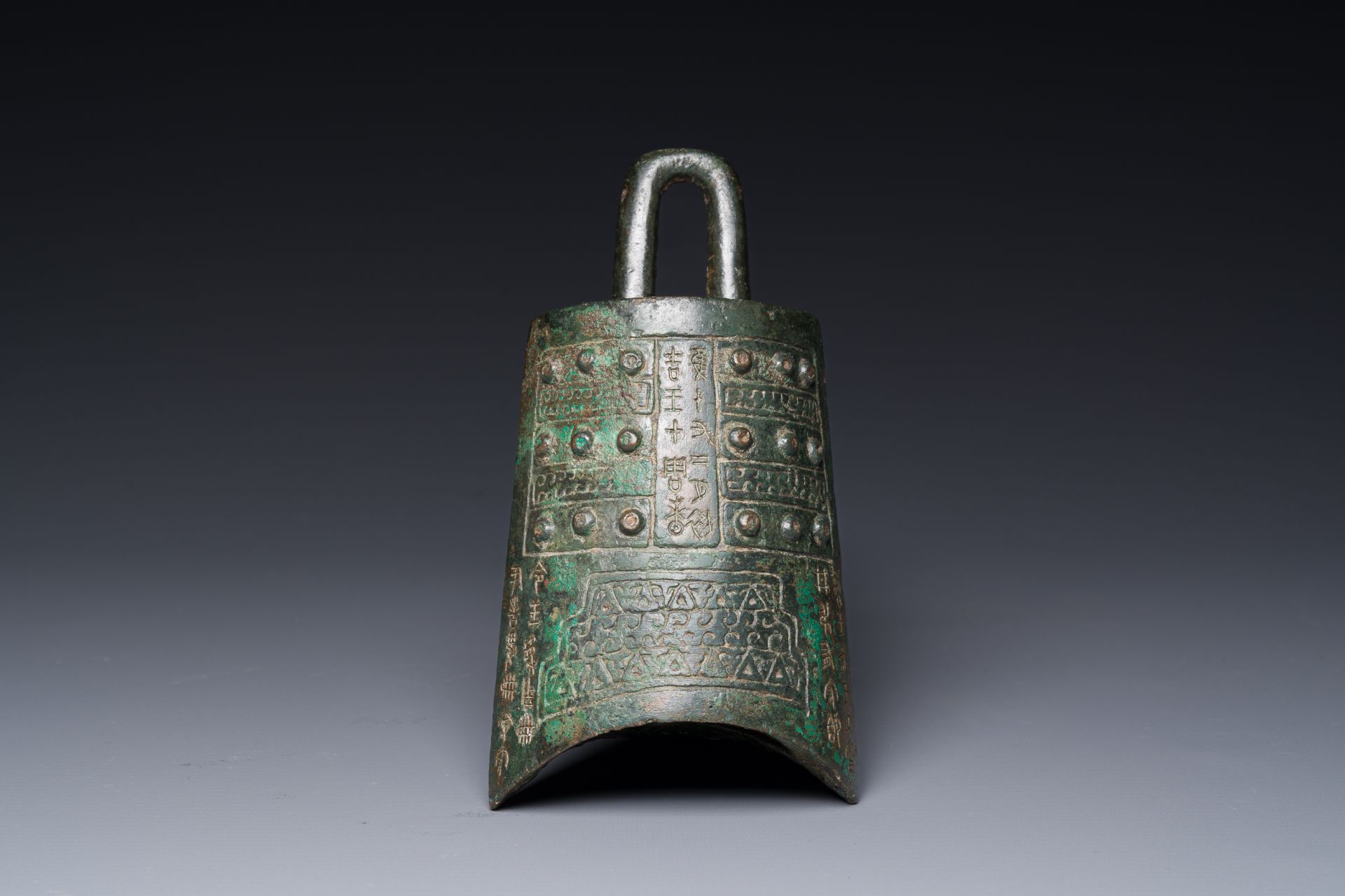 A rare Chinese inscribed archaic bronze bell, Eastern Zhou