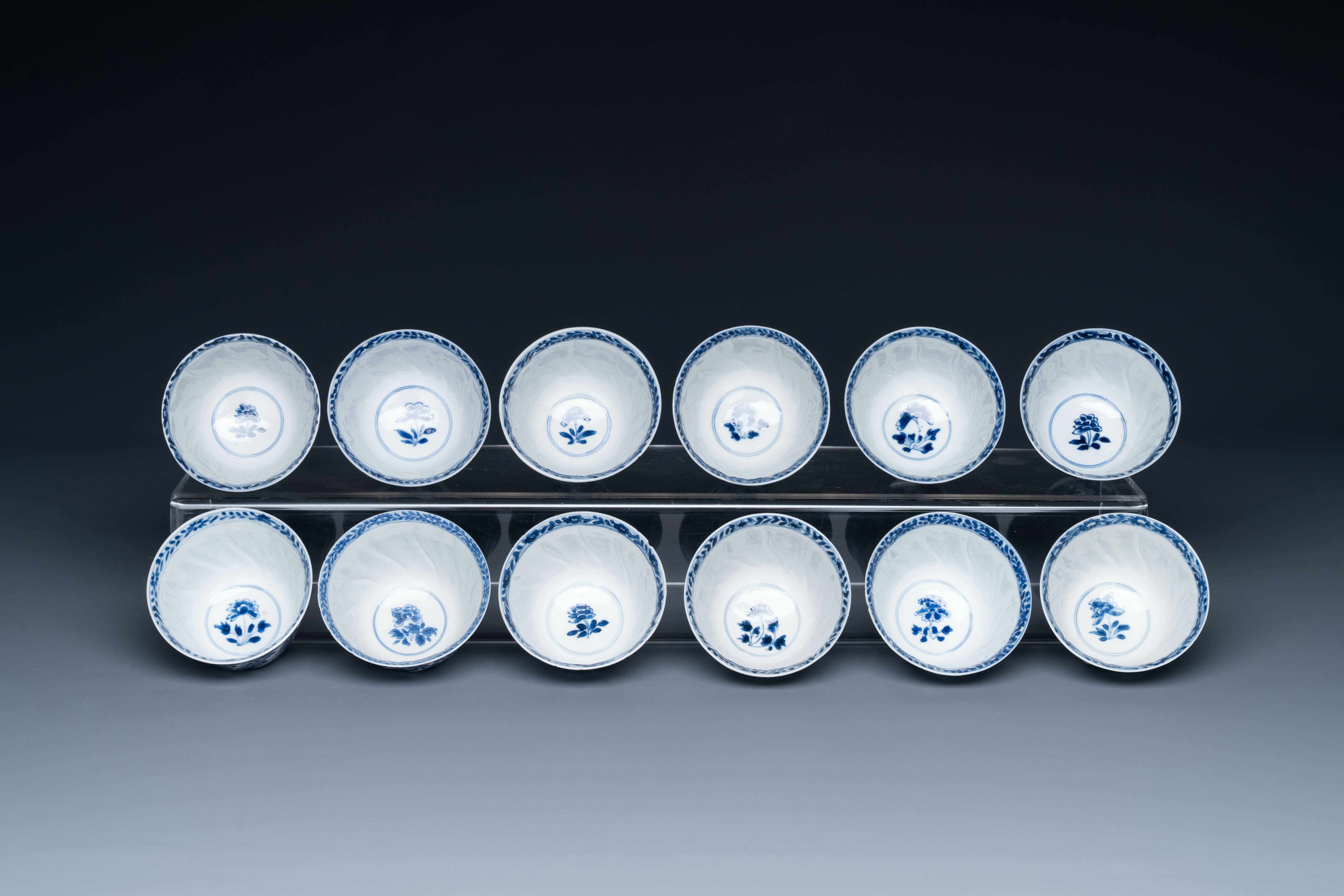 Twelve Chinese blue and white cups and saucers with floral design, jade mark, Kangxi - Image 6 of 7