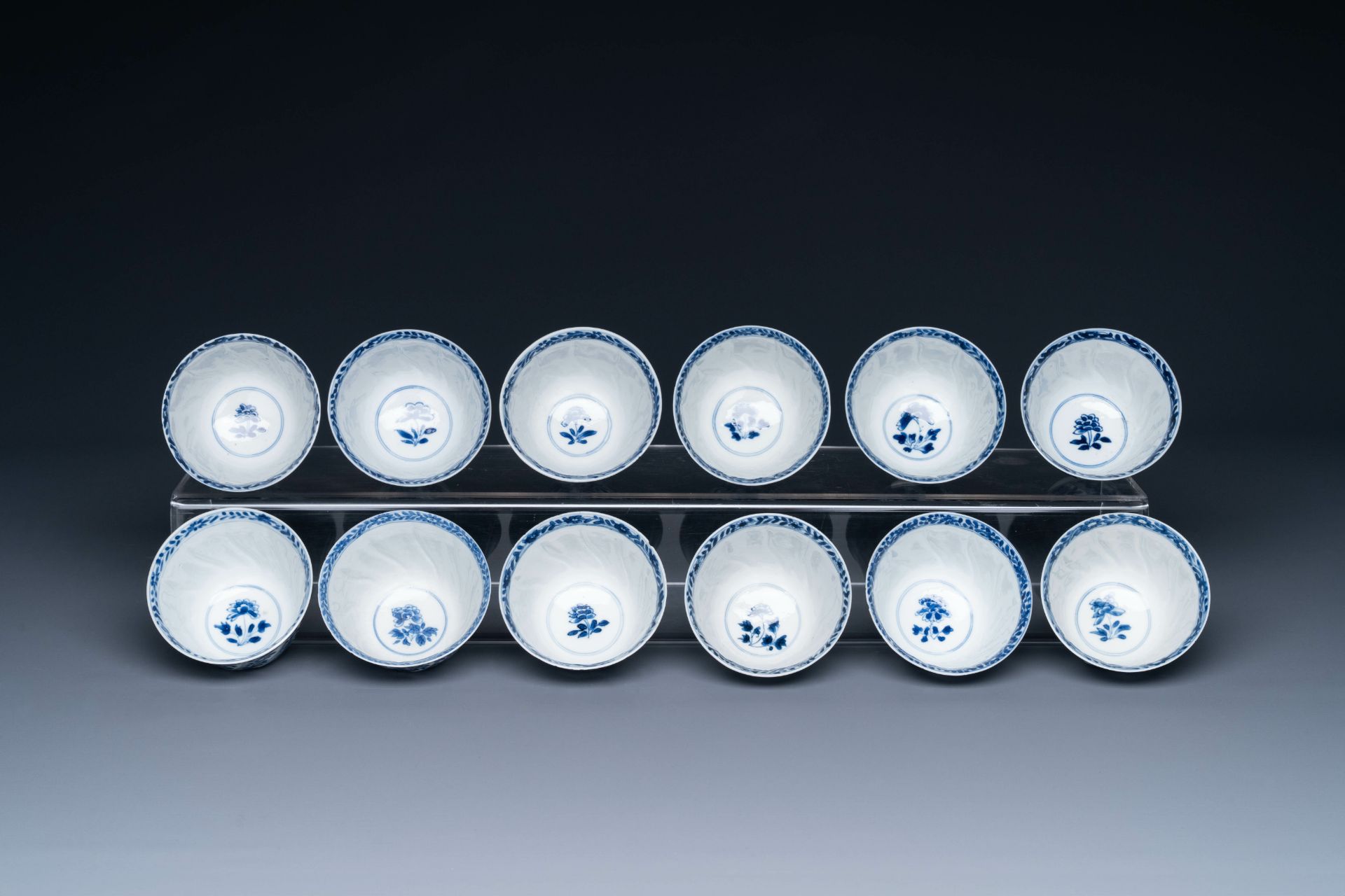 Twelve Chinese blue and white cups and saucers with floral design, jade mark, Kangxi - Image 6 of 7