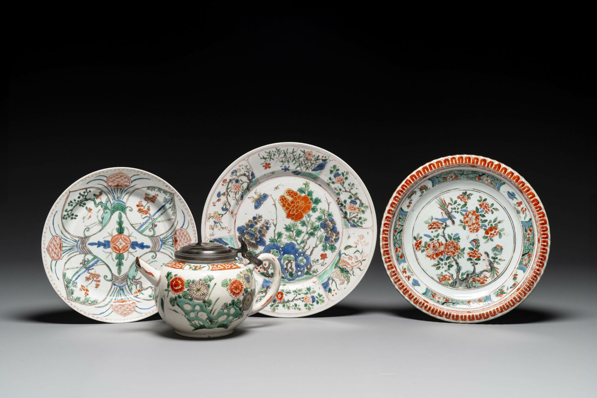 Three Chinese famille verte plates and a teapot, Kangxi