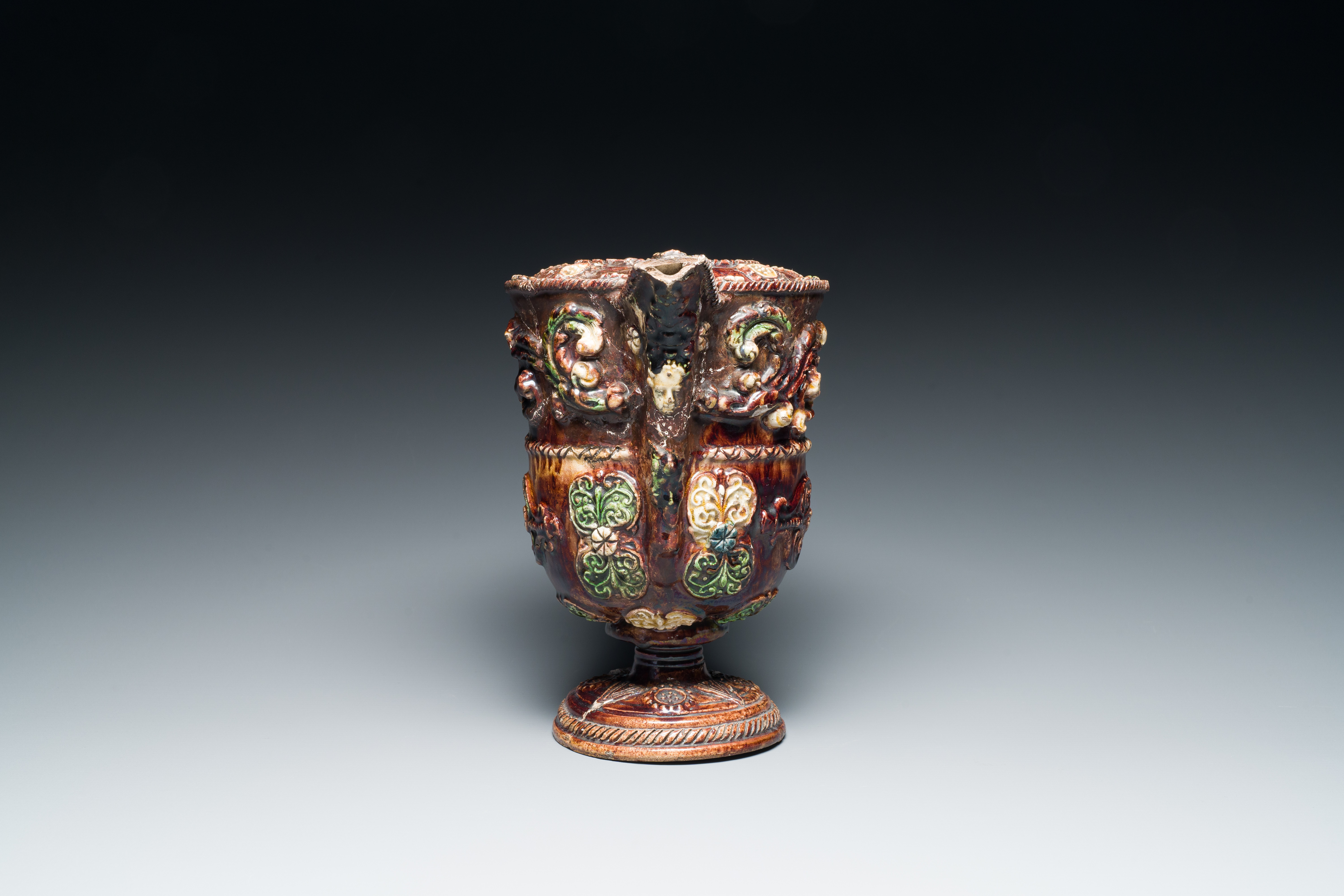 A French polychrome lead-glazed earthenware puzzle jug, Saintonge, 1st half 17th C. - Image 7 of 19