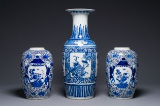 A pair of Chinese blue and white jars and a vase, Kangxi mark, 19th C.