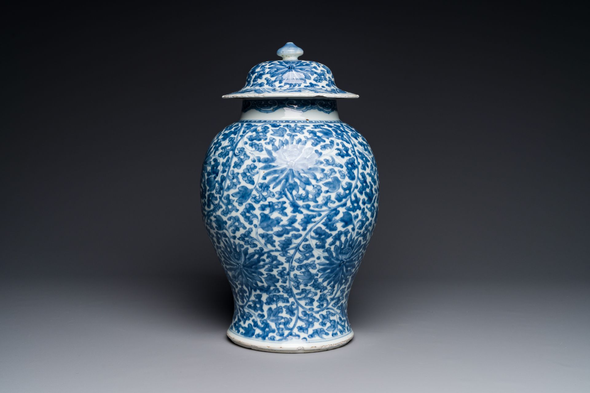 A Chinese blue and white 'lotus scroll' vase and cover, Kangxi