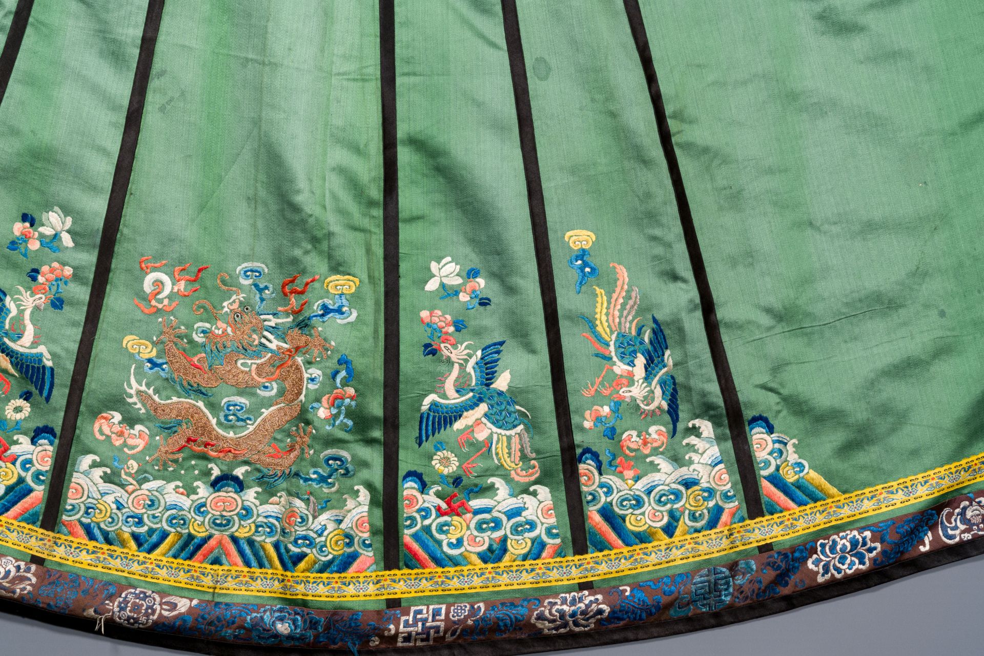 A Chinese embroidered silk 'dragon and phoenix' skirt and a wallet pouch, 18/19th C. - Image 8 of 10