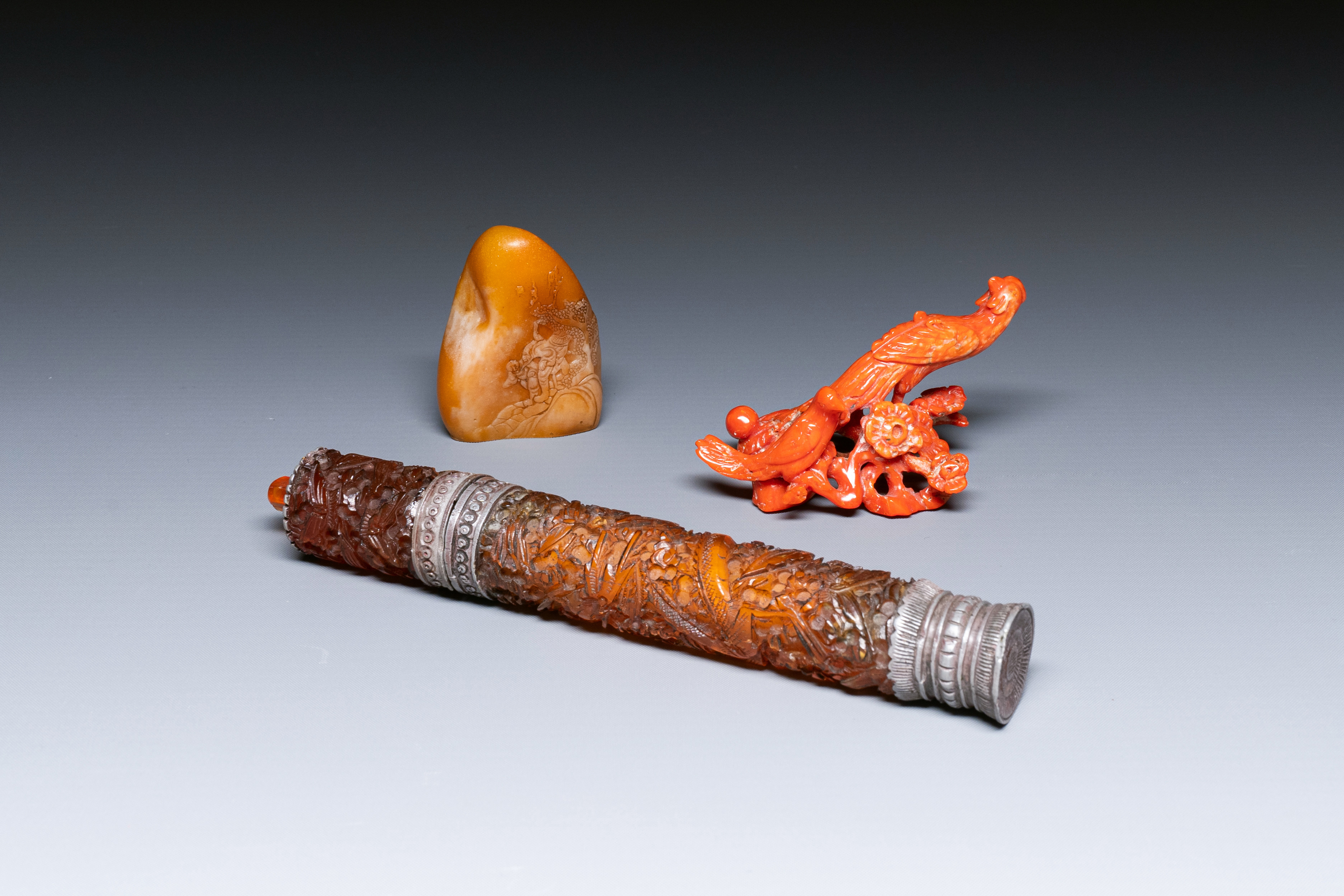 A red coral carving of birds, a yellow stone carving of a landscape and an incense holder, China, 19