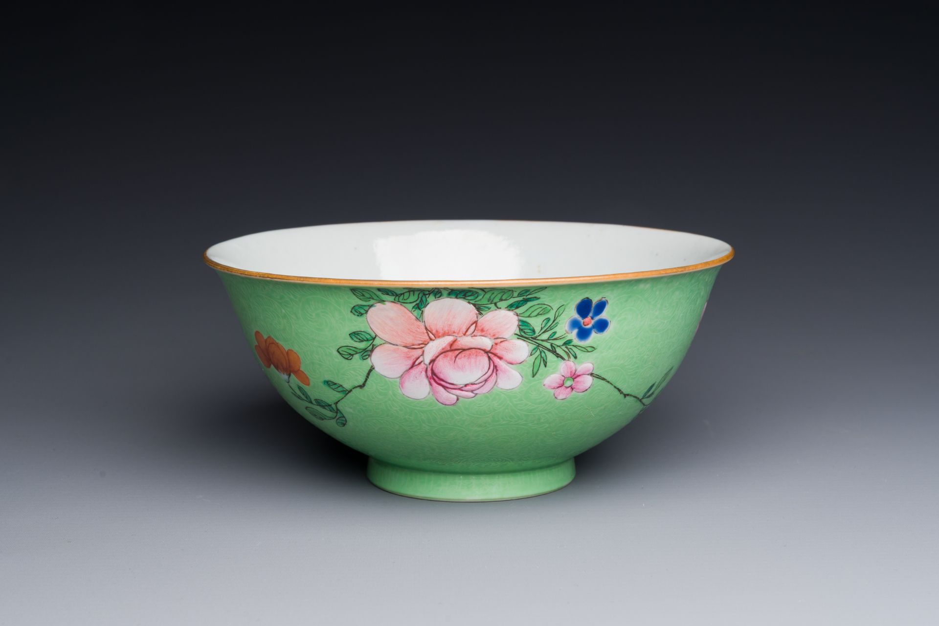 A Chinese green-sgraffito-ground famille rose bowl, Qianlong mark and of the period