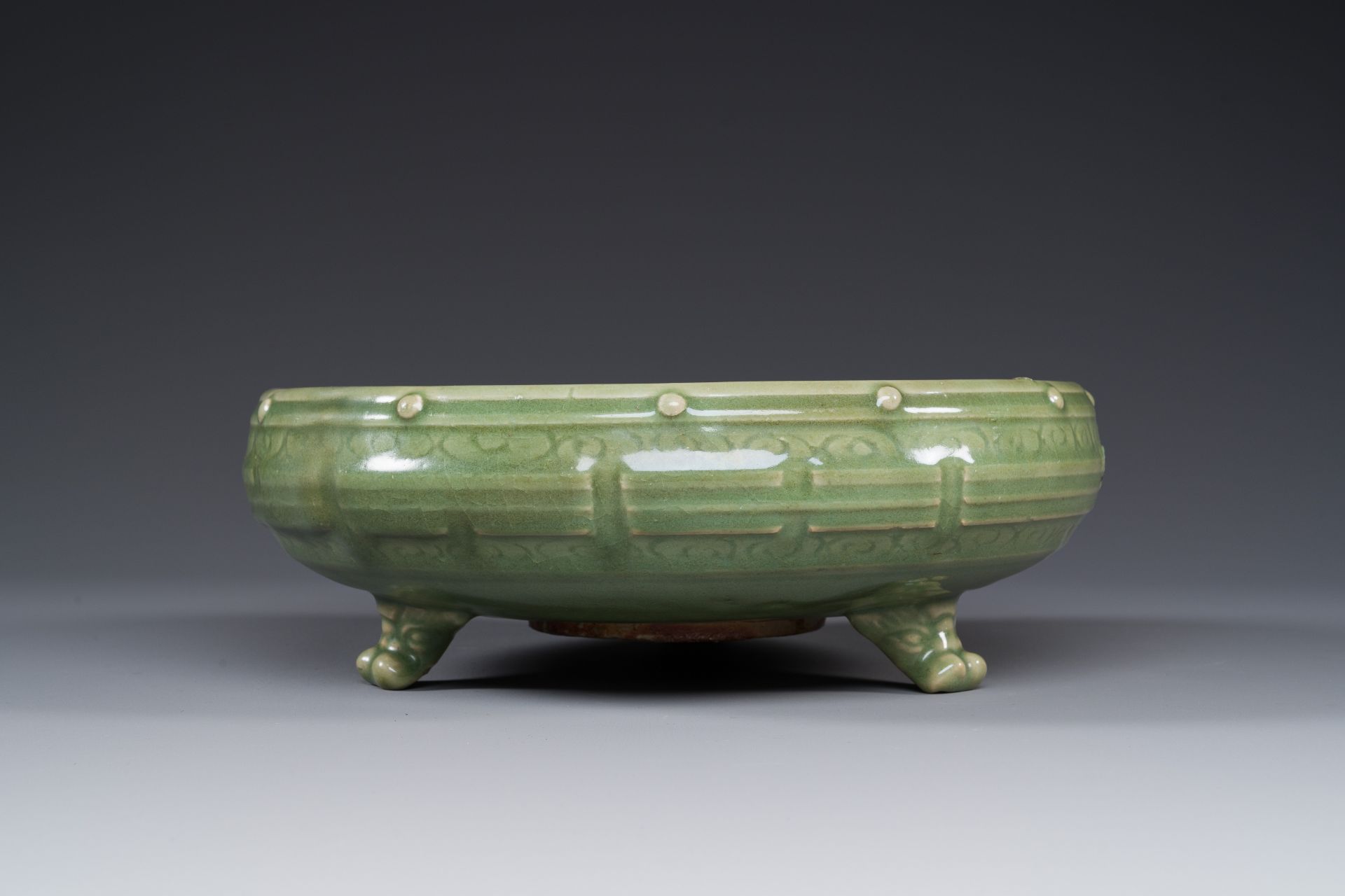 A Chinese Longquan celadon tripod censer on wooden stand, Yuan/Ming - Image 4 of 10