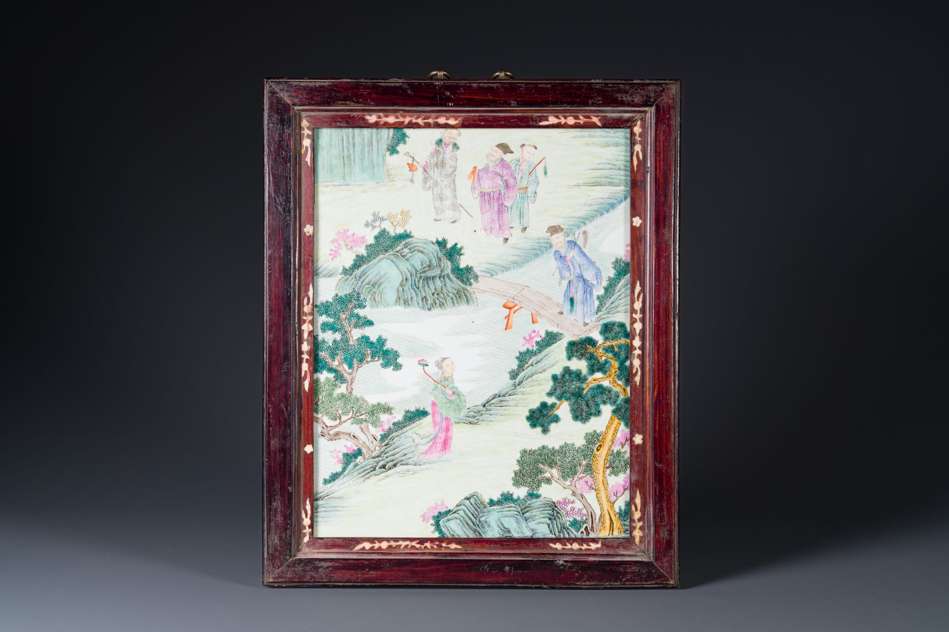 A Chinese famille rose 'eight immortals' plaque in wooden frame, 18/19th C.