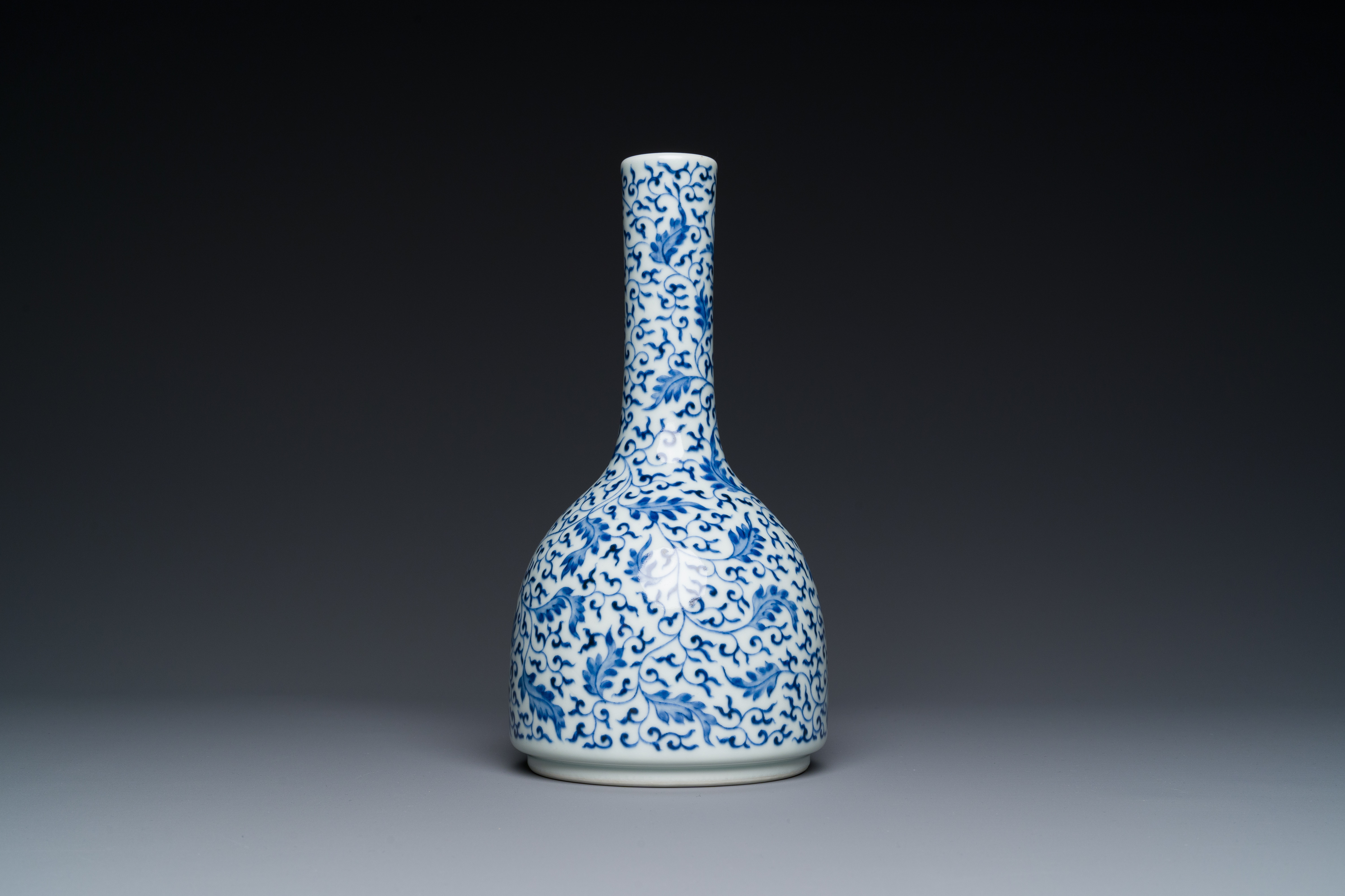 A Chinese blue and white 'lotus scroll' bottle vase, Yongzheng mark and possibly of the period