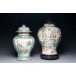 Two Chinese famille verte porcelain vases and covers on wooden stands, 19th C.