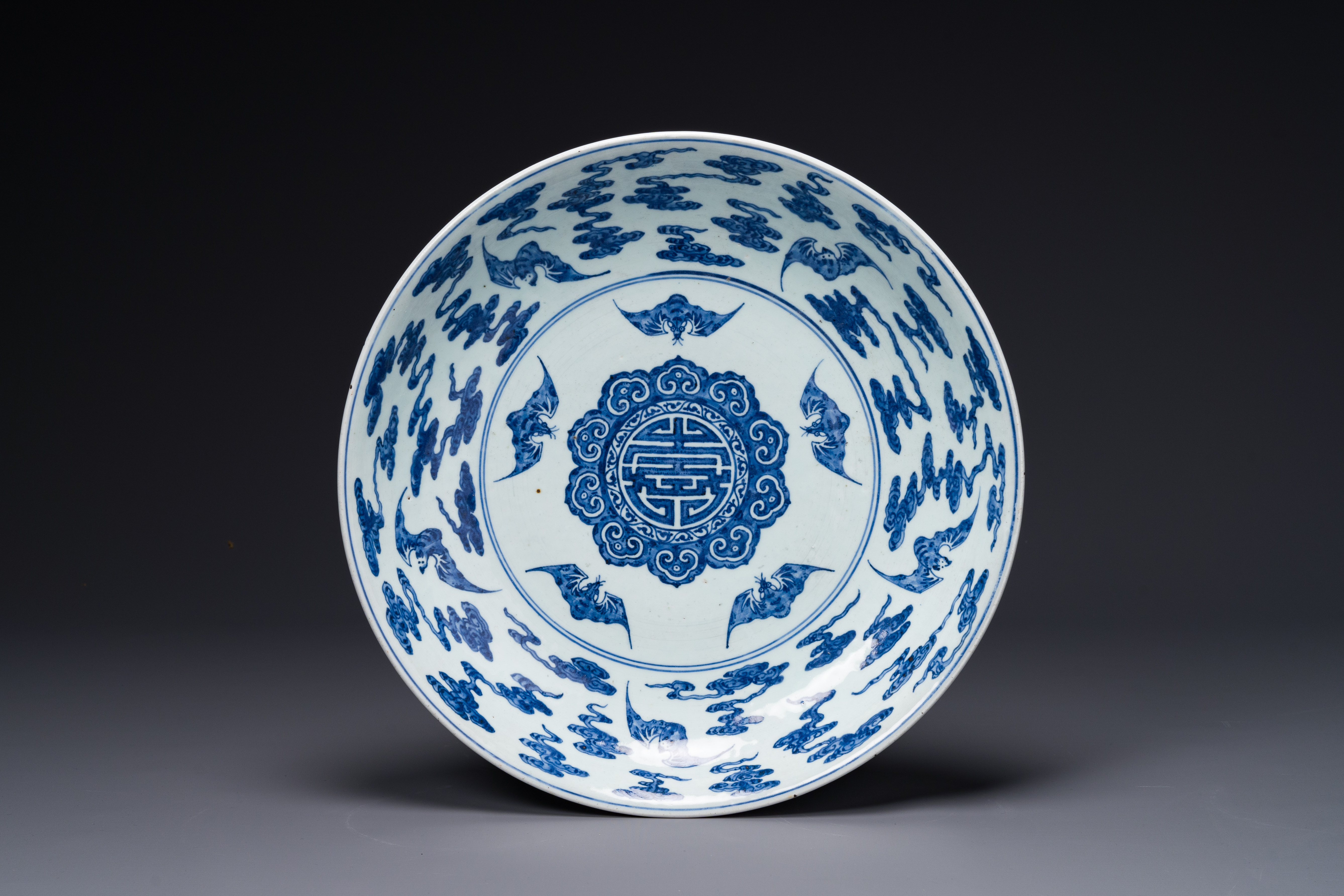 A large Chinese blue and white 'Bats and longevity' dish, 19th C.