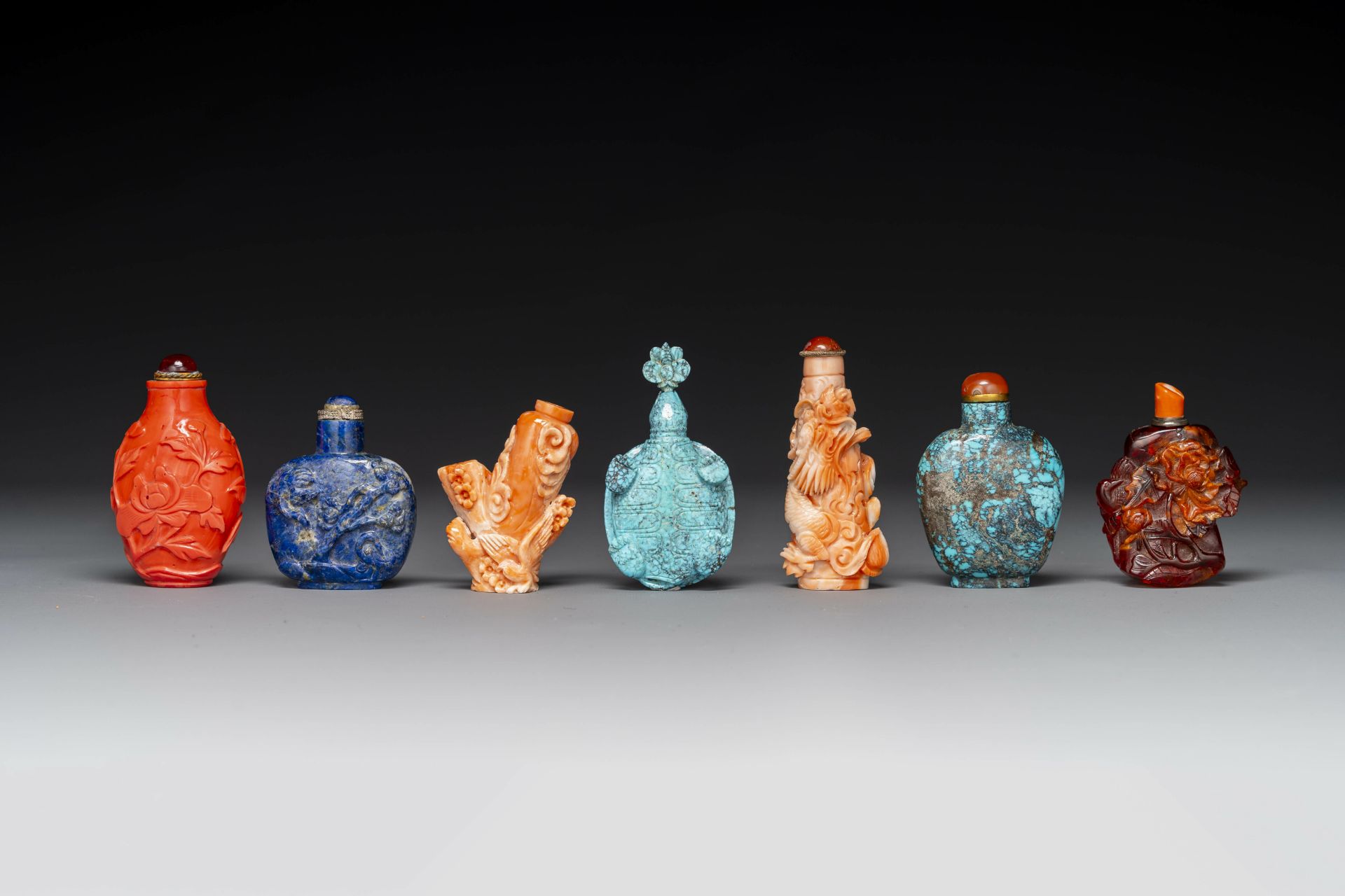 Seven varied Chinese snuff bottles of precious stone, red coral, glass and amber, 19th C. - Image 3 of 7