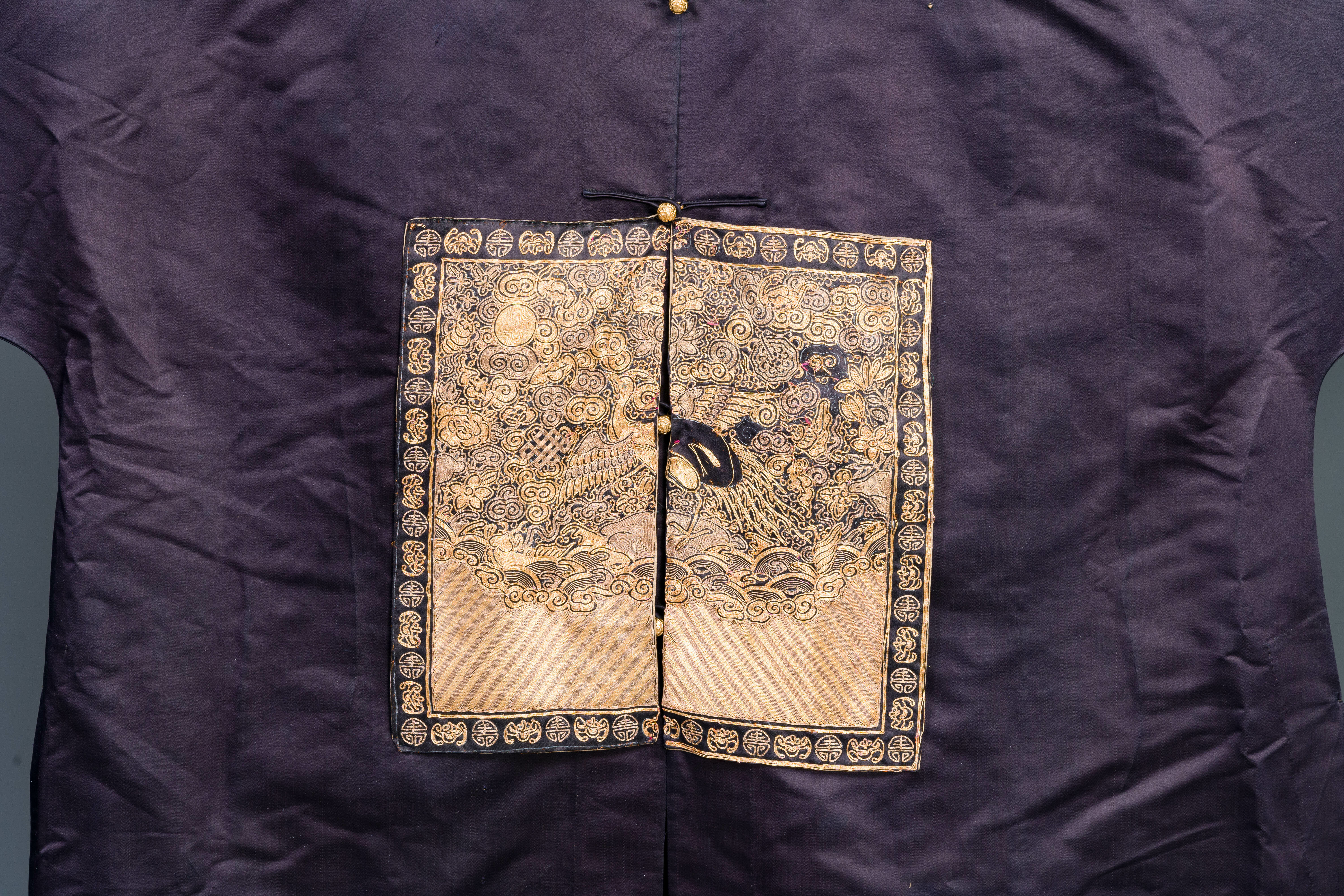 A Chinese dark blue silk overcoat with gold thread embroidered 'rank badges' with wild geese, 19th C - Image 2 of 3