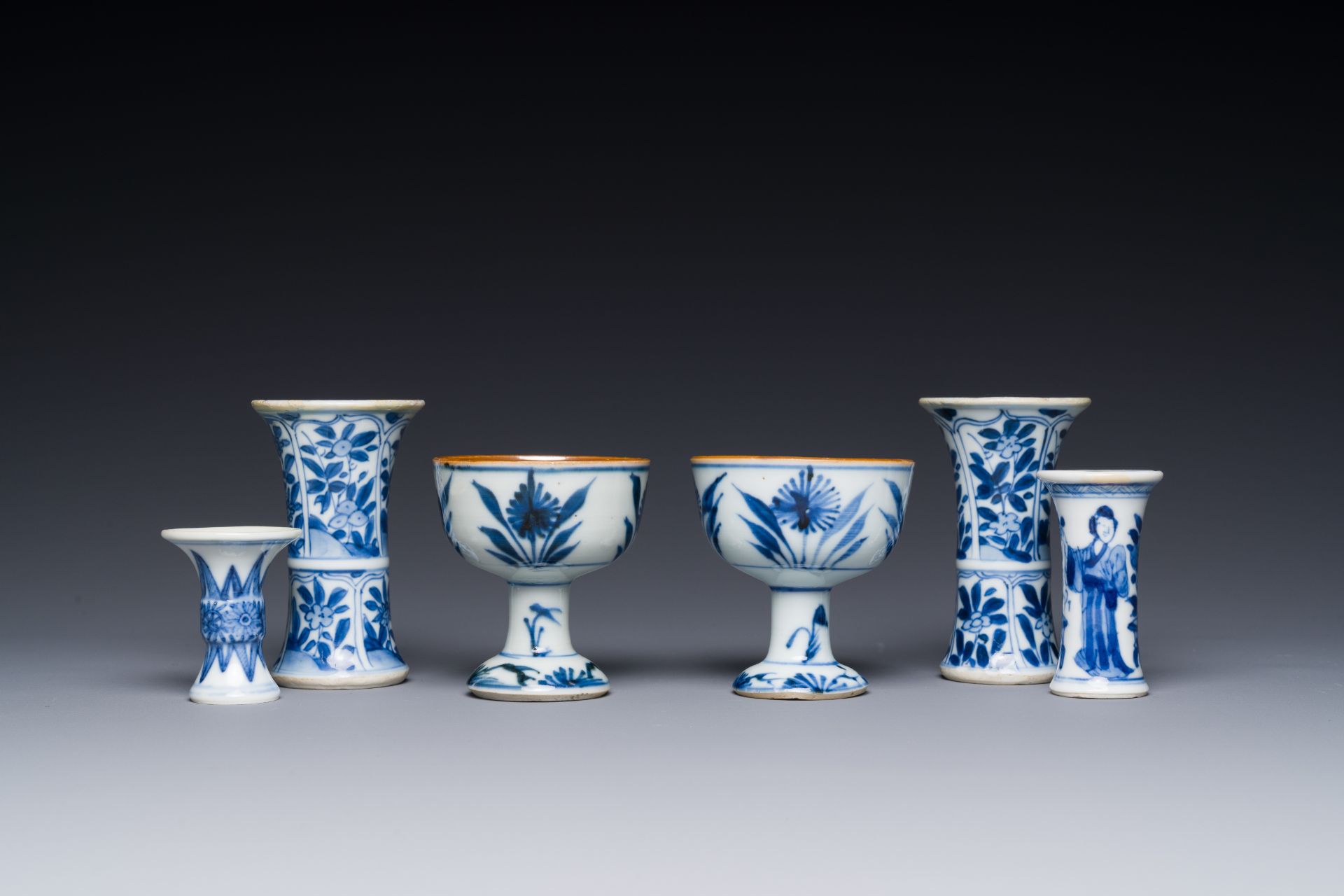Two Chinese blue and white stem cups and four miniature 'gu' vases, Kangxi - Image 3 of 6
