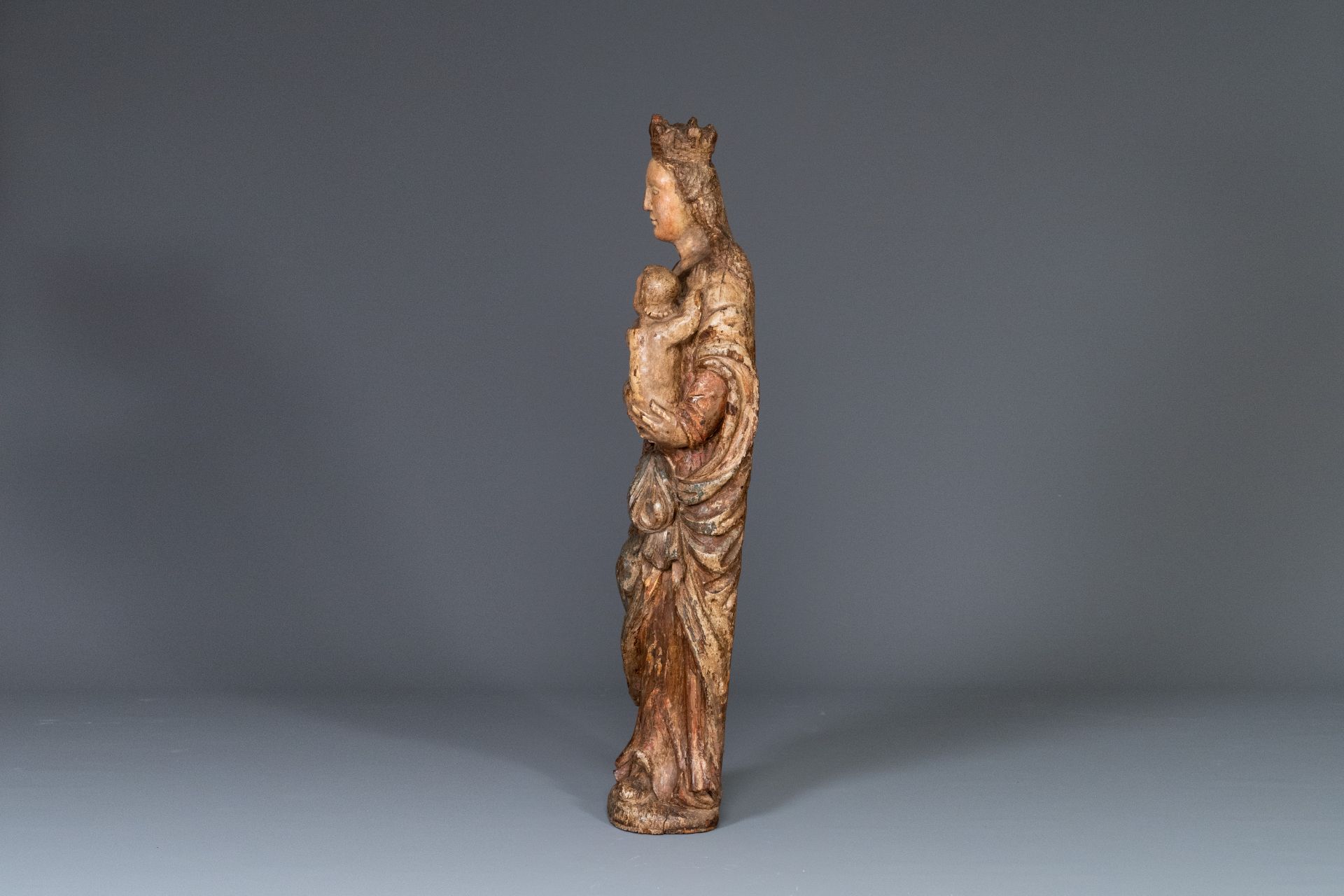 A polychromed carved oak figure of a Madonna and Child, France, 2nd half of 16th C. - Image 4 of 16