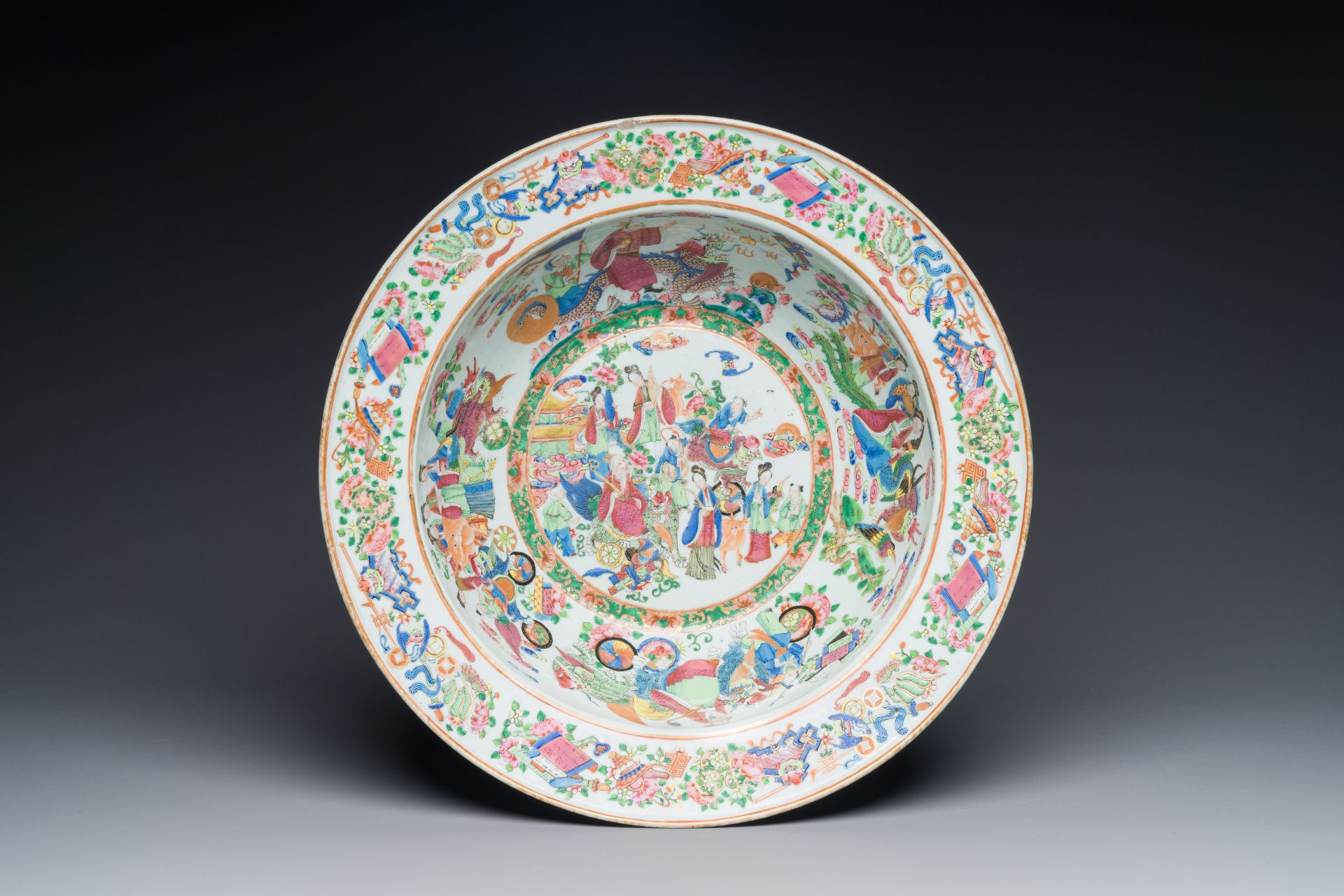 A large Chinese Canton famille rose 'Qi Lin Song Zi' basin, 19th C.