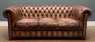 'FLEMING & HOWLAND' LEATHER CHESTERFIELD SOFA, three loose cushions, turned front legs, castors, 200