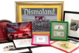 COLLECTION 'DISMALAND' EPHEMERA, including 2 stencilled cardbaord fragments, 2 defaced $1 bills,