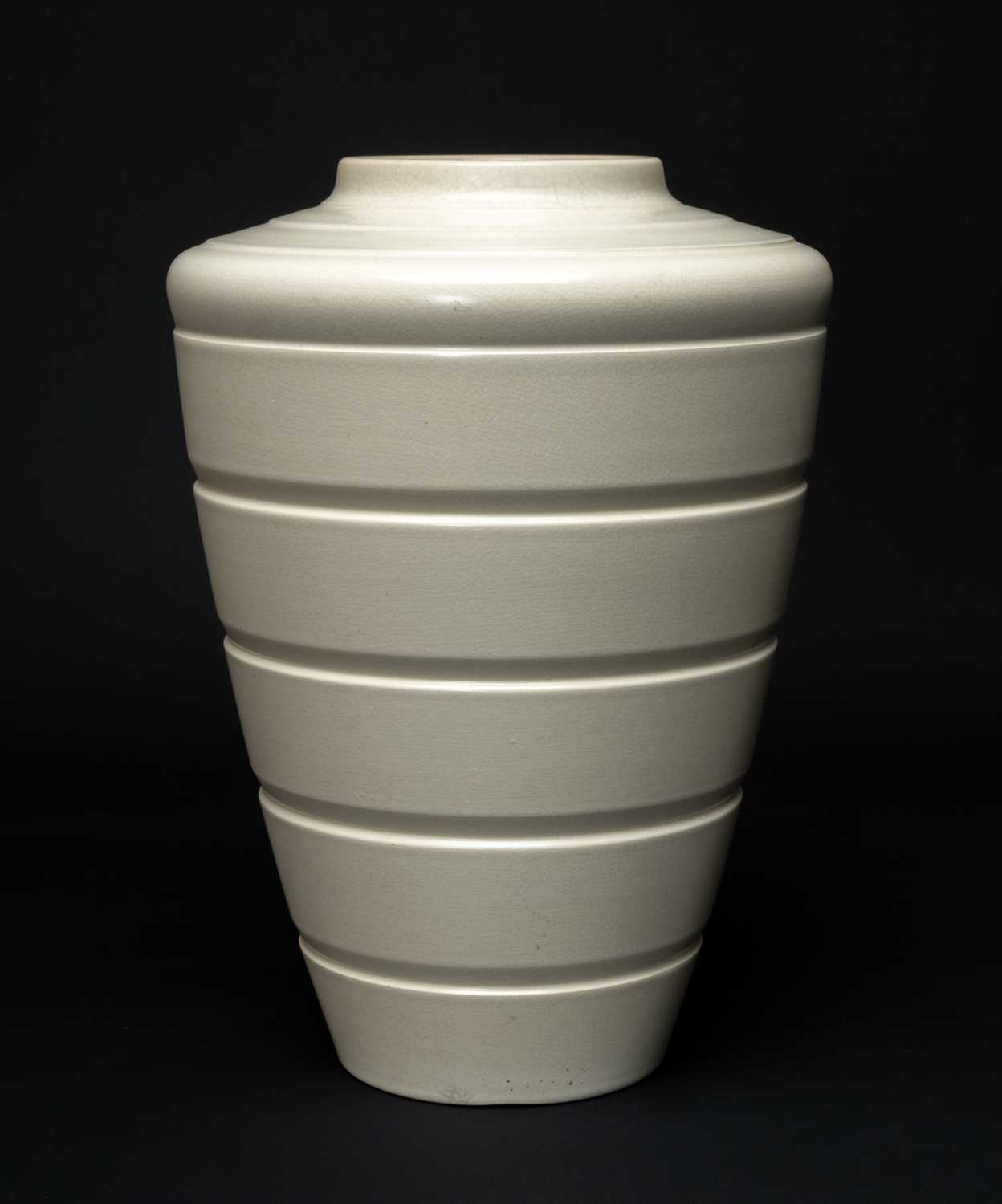 KEITH MURRAY FOR WEDGWOOD: tapering circular moonstone glazed white vase, black backstamps, 28cms (