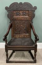 18TH CENTURY OAK WAINSCOTT ARMCHAIR circa 1790, scroll-carved crest and corbels to an inlaid