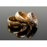 THREE 9CT GOLD RINGS, two plain and one engraved, 18.8gms gross (3) Provenance: deceased estate