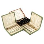 THREE CASED SETS OF SIX WHITE METAL TEA SPOONS, two sets with bamboo design stems and green