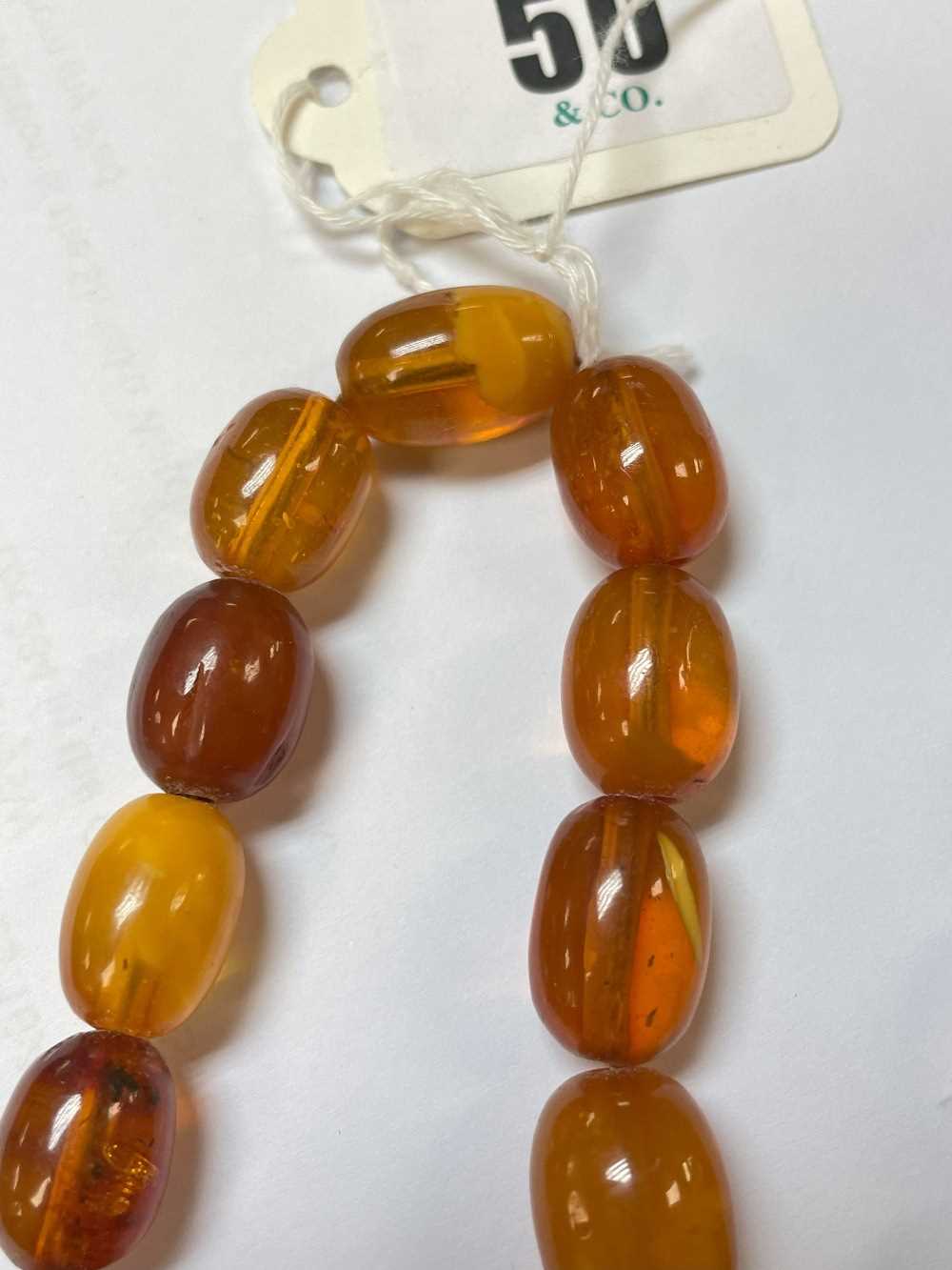 SINGLE STRAND AMBER BEAD NECKLACE, beads 13mm to 20mm, approx gross wt. 55gms - Image 7 of 13