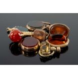 ASSORTED FOBS & SEALS comprising yellow metal carved carnelian intaglio seal depicting Roman head,