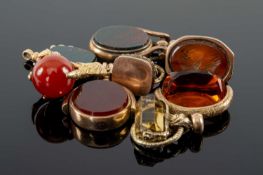 ASSORTED FOBS & SEALS comprising yellow metal carved carnelian intaglio seal depicting Roman head,