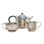 GEORGE VI SILVER THREE-PIECE TEA SET, Sheffield 1946, circular form with angled stepped top, total