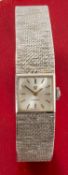 9CT WHITE GOLD OMEGA LADIES' WRISTWATCH, the inside back cover numbered 7115698, integrated 9ct