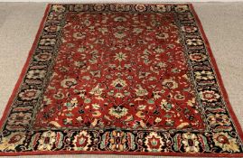 EASTERN STYLE RED & BLACK GROUND TRADITIONAL STYLE RUG all over opposing floral central pattern,