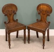 PAIR VICTORIAN OAK SHIELD BACK HALL CHAIRS, scrolled detail to the backs, solid seats, turned