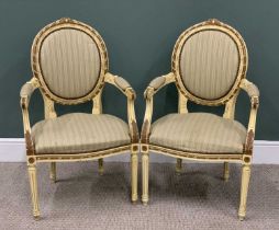 PAIR OF PARIS-STYLE SALON ARMCHAIRS, oval cameo backs, swept arms, striped upholstery, carved detail