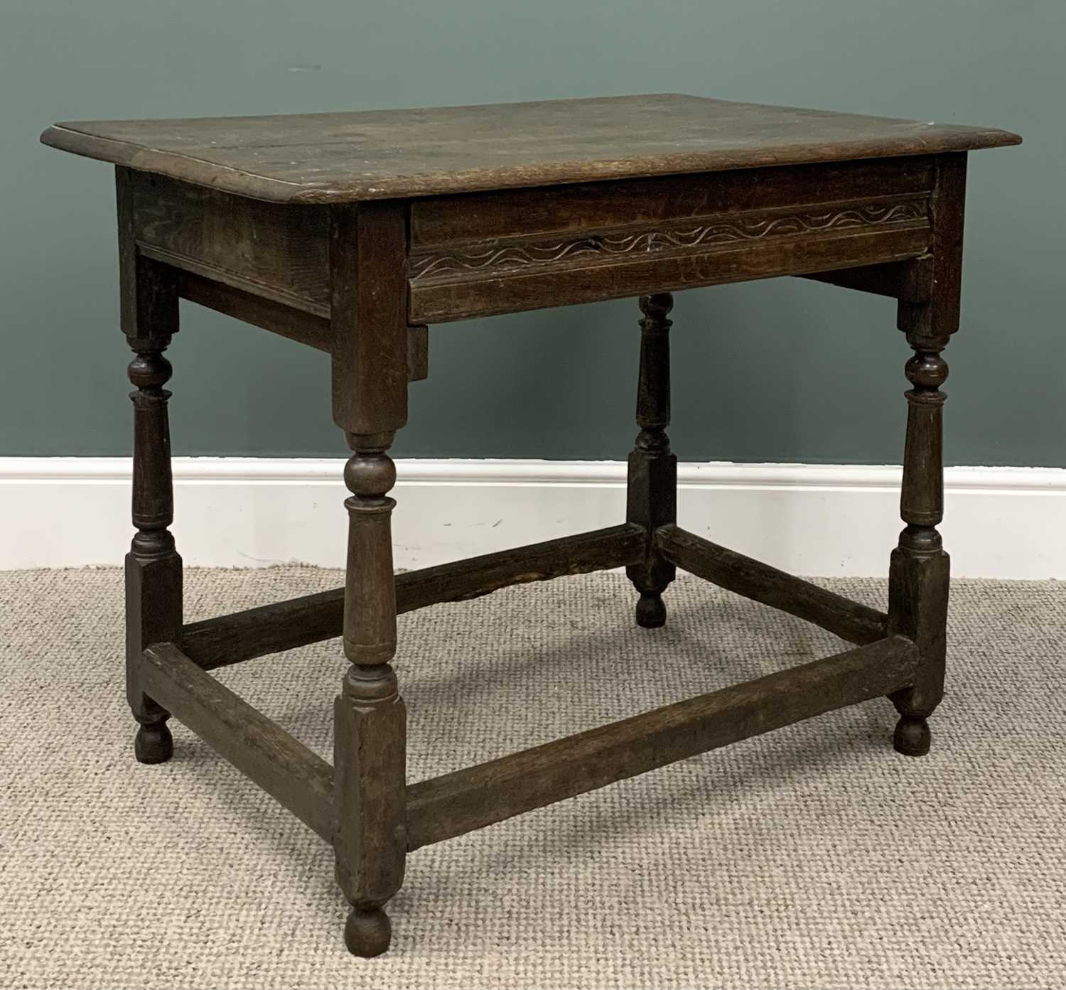 ANTIQUE OAK SINGLE DRAWER TABLE circa 1800, planked top, moulded edge, carved drawer front, peg - Image 3 of 4