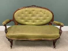 VICTORIAN WALNUT FRAMED SALON COUCH, button upholstered oval cameo back, carved crest rail, swept
