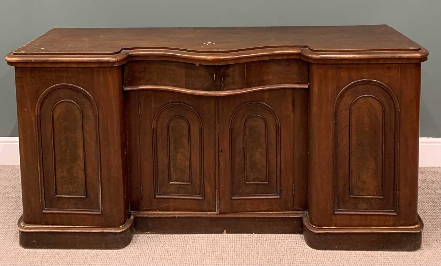 VICTORIAN MAHOGANY SERPENTINE SIDEBOARD BASE, moulded edging, shaped central frieze drawer, double