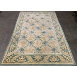 EASTERN STYLE WOOLLEN RUG, pure new wool pile, muted green and gilt tones, Tudor style central block