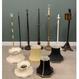 SEVEN VARIOUS STANDARD LAMPS, to include an oak barley twist example, circular base, turned bun