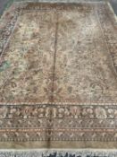 LARGE EASTERN STYLE WOOLLEN RUG, green ground, urn and floral repeating central block pattern, eight