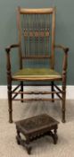 CROSSBANDED SPINDLE BACK ARMCHAIR & A SMALL CARVED OAK FOOTSTOOL, slightly curved double spindle