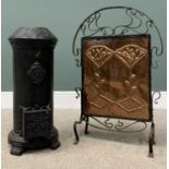 CAST IRON CYLINDRICAL STOVE & AN ARTS & CRAFTS STYLE FIRESCREEN, wrought iron and copper firescreen,