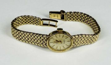 MARVIN REVUE 9CT GOLD LADIES INTEGRAL BRACELET WRISTWATCH, oval dial, baton markers, quartz