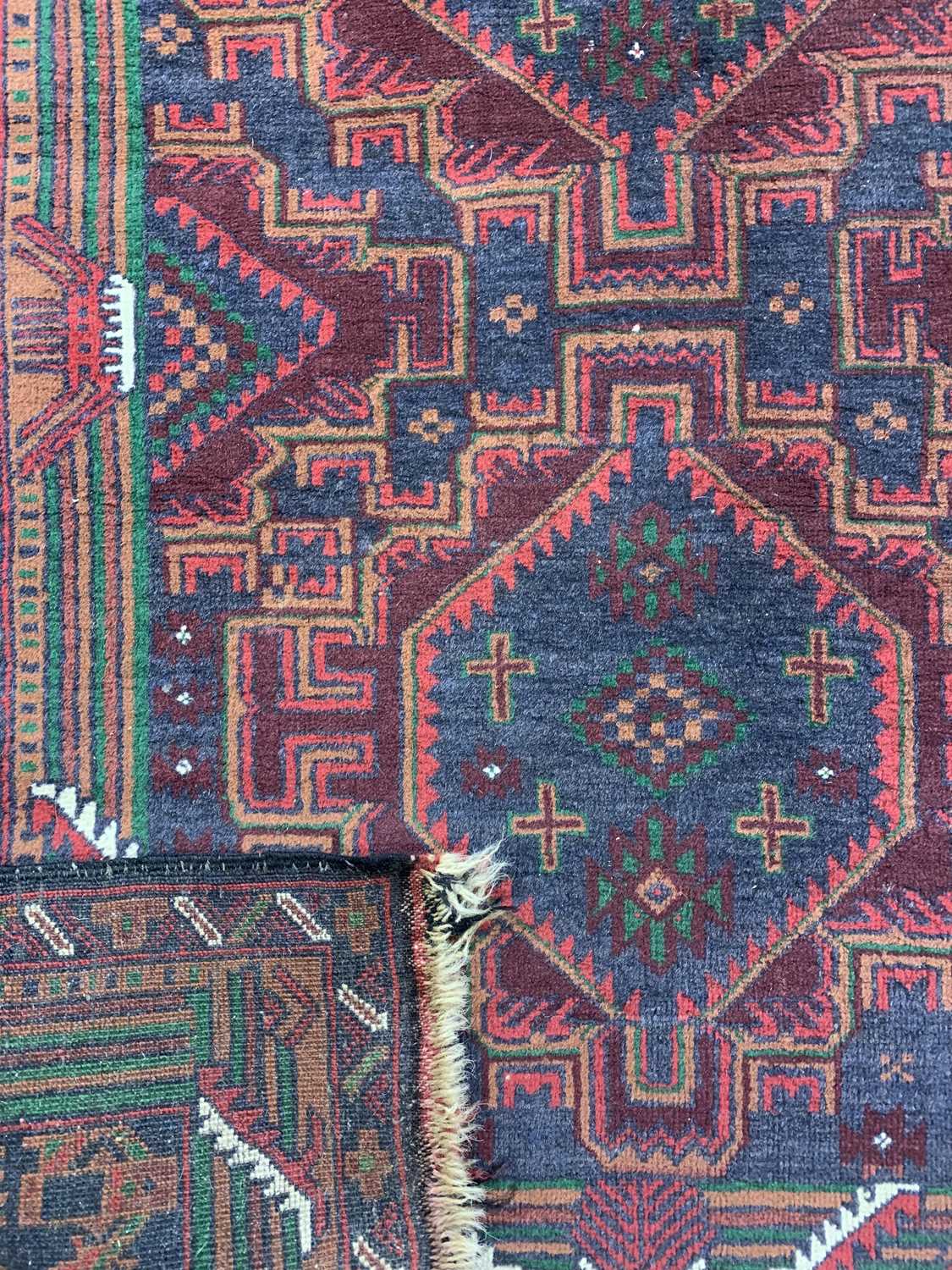 PERSIAN RED/BLUE GROUND HANDMADE WOOL RUG, triple medallion centre, geometric border, 192 x 113cms - Image 3 of 3